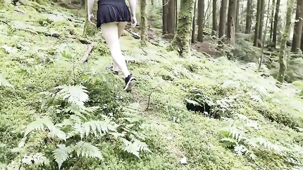 EXPOSING HERSELF IN PUBLIC walking nude in the forest short skirt and no panties (2025 | SD)