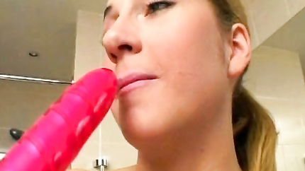 All-natural German beauty teases her cunt with dildo in bathroom (2026 | SD)
